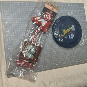 Red and White Dog Pull Toy and a disk blue new Disney tails